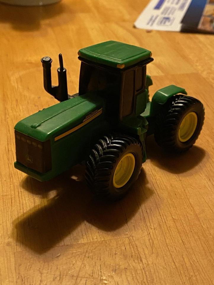 This is a big tractor that farmers use on farms,