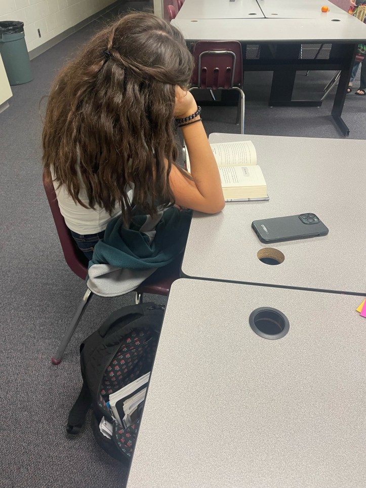 Marlene is reading her book "A Good Girl's Guide to Murder"