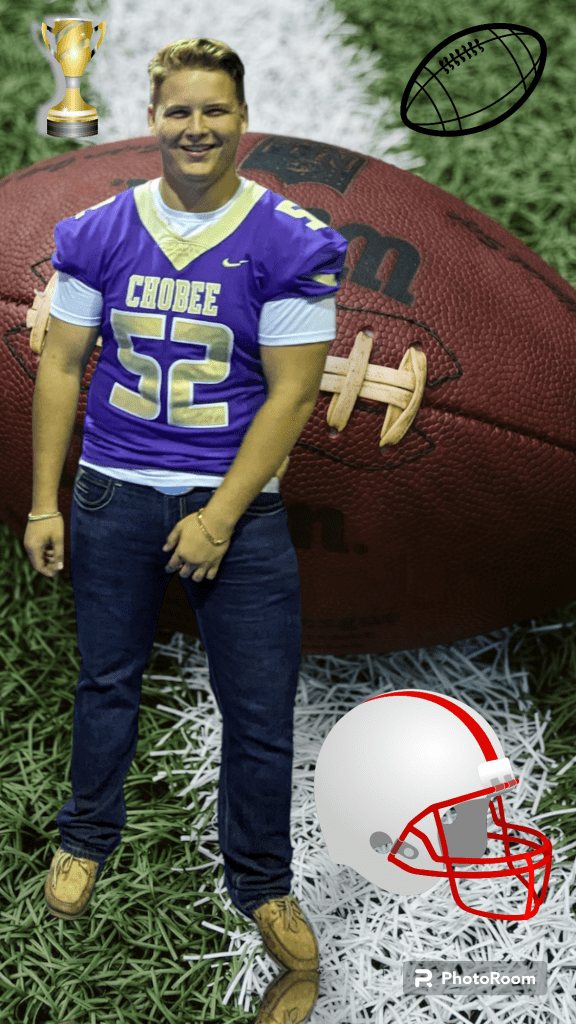 A full front body picture of Cantalini standing with his feet apart and his left hand in front of him. He is smiling at the camera.