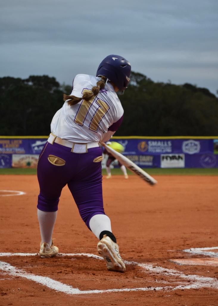Audra Friend (10) hitting the ball.